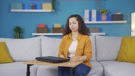 Young-woman-closing-laptop-with-angry-expression.